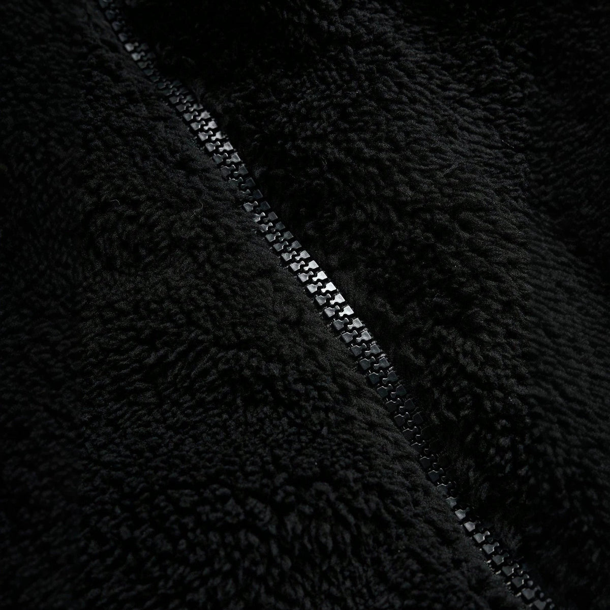 Black Furry Jacket With A Zipper And Embroidery On The Left Chest