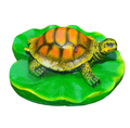Turtle resin ornaments floating on the water surface