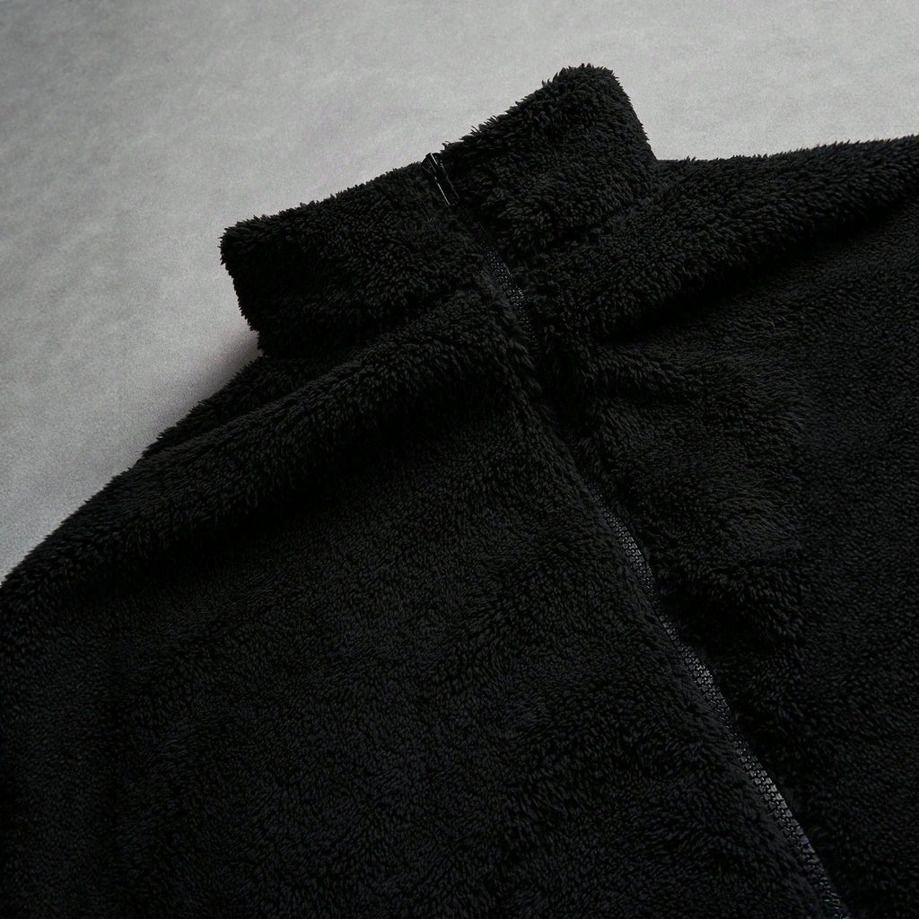 Black Furry Jacket With A Zipper And Embroidery On The Left Chest